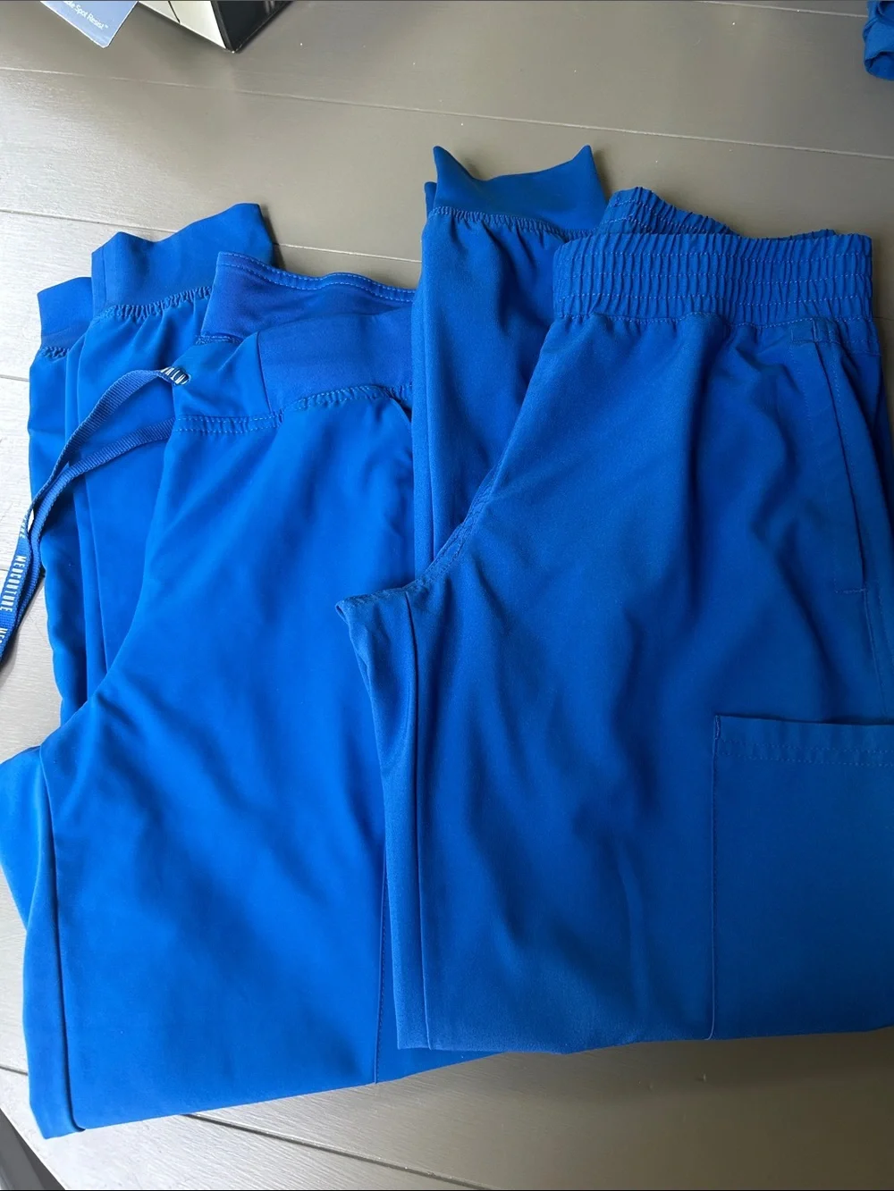Bundle of royal blue nursing scrubs